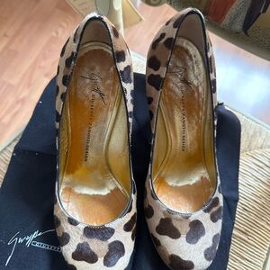 Giuseppe Zanotti calf hair leopard print wedge with red patent leather heels.